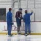 Colorado Avalanche forward Valeri Nichushkin works with skills coach Toby Petersen after the team finished practice and left the ice.
